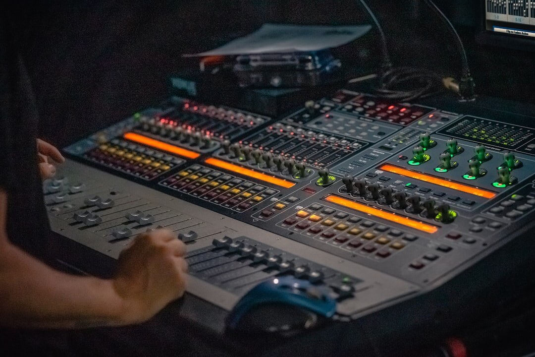 Technician operating a live video streaming switcher panel